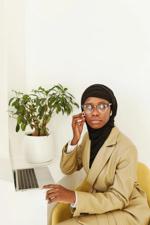 a lady in her own home on her cell phone