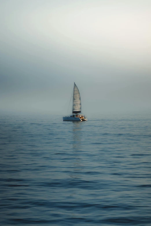 a sail boat is on the open water