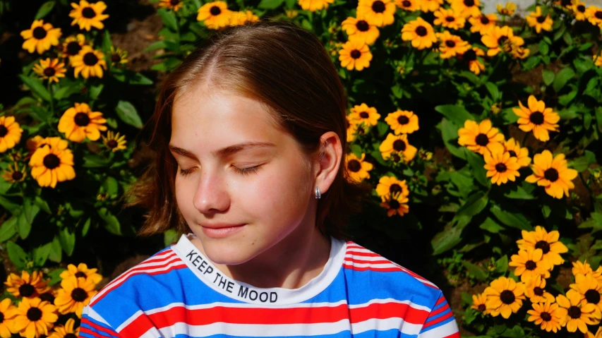 a girl is looking down at her phone