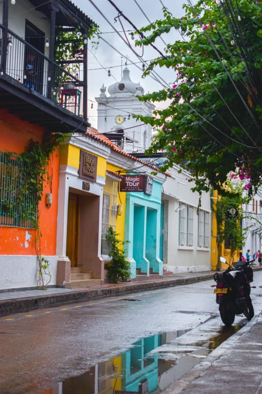 colorful houses and buildings lining an urban street