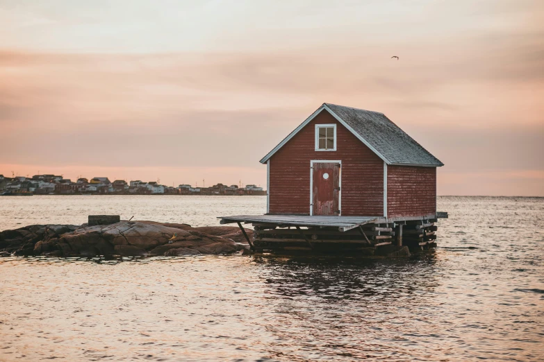 an image of a house on the water