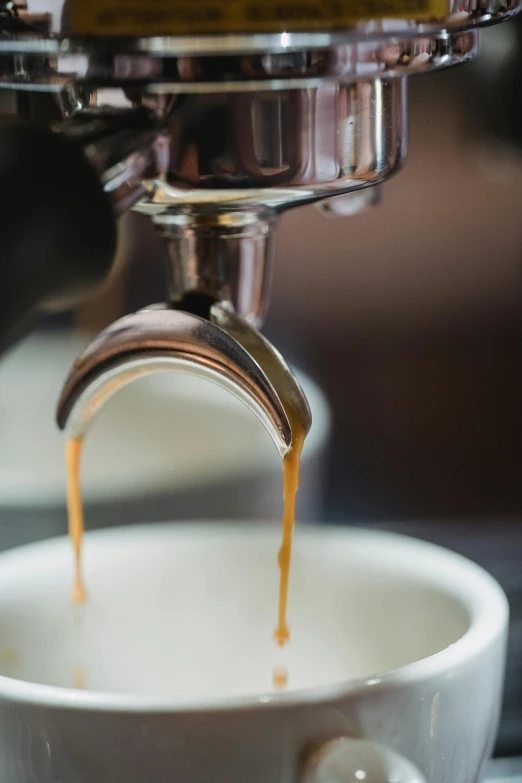 coffee being poured into a cup