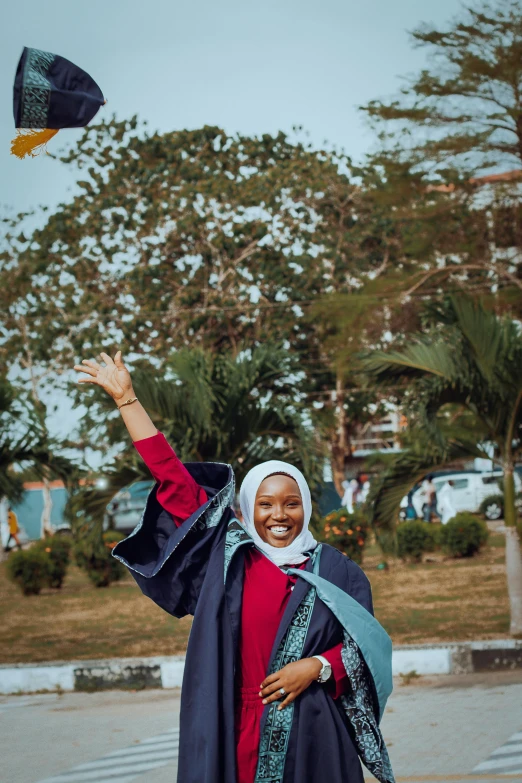 the woman is smiling while flying her kite