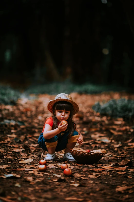 a small child is eating from a basket