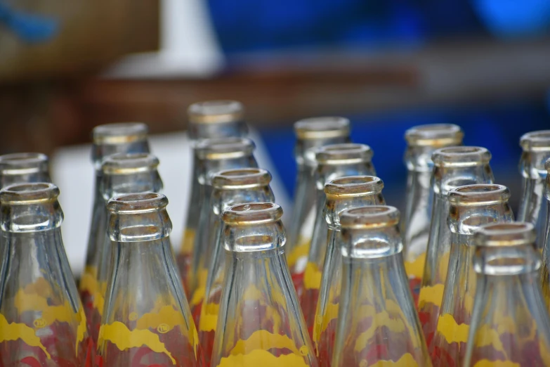 a close - up of the top half of a group of glass bottles