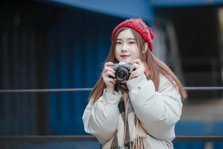 a woman taking pictures with her camera
