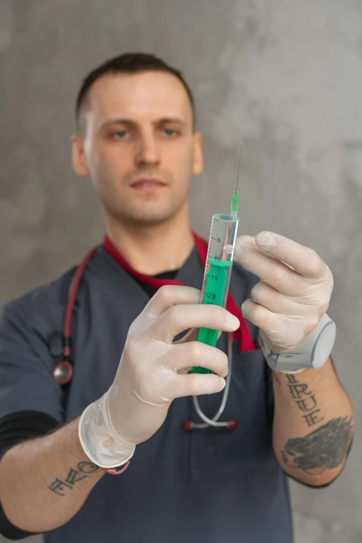 a man in a medical outfit holding an oxygen tube