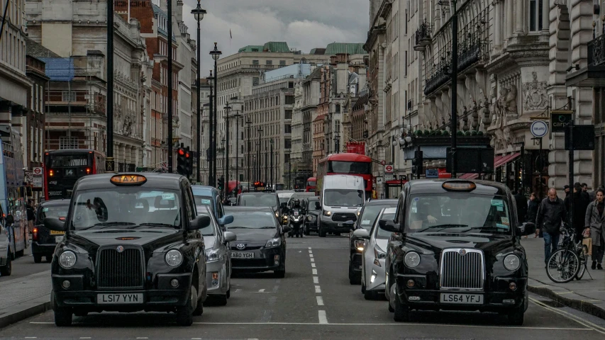 buses, cars and buses on a city street