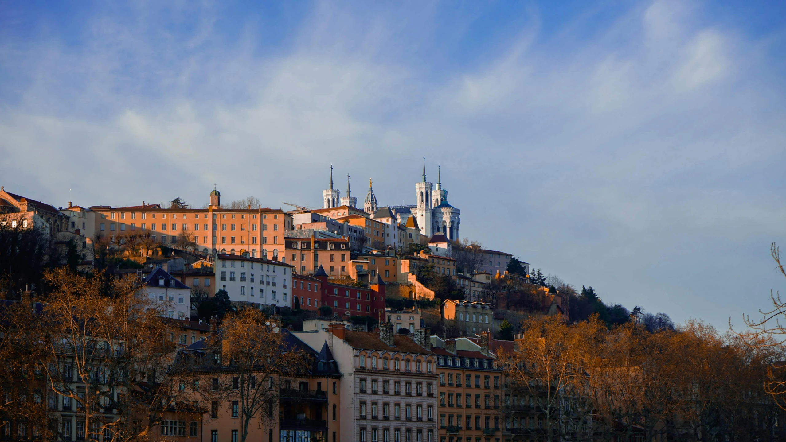 a group of buildings sitting on top of a hill