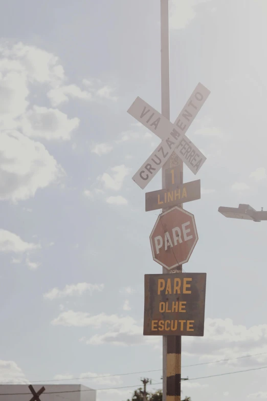 a street sign has a stop sign underneath it