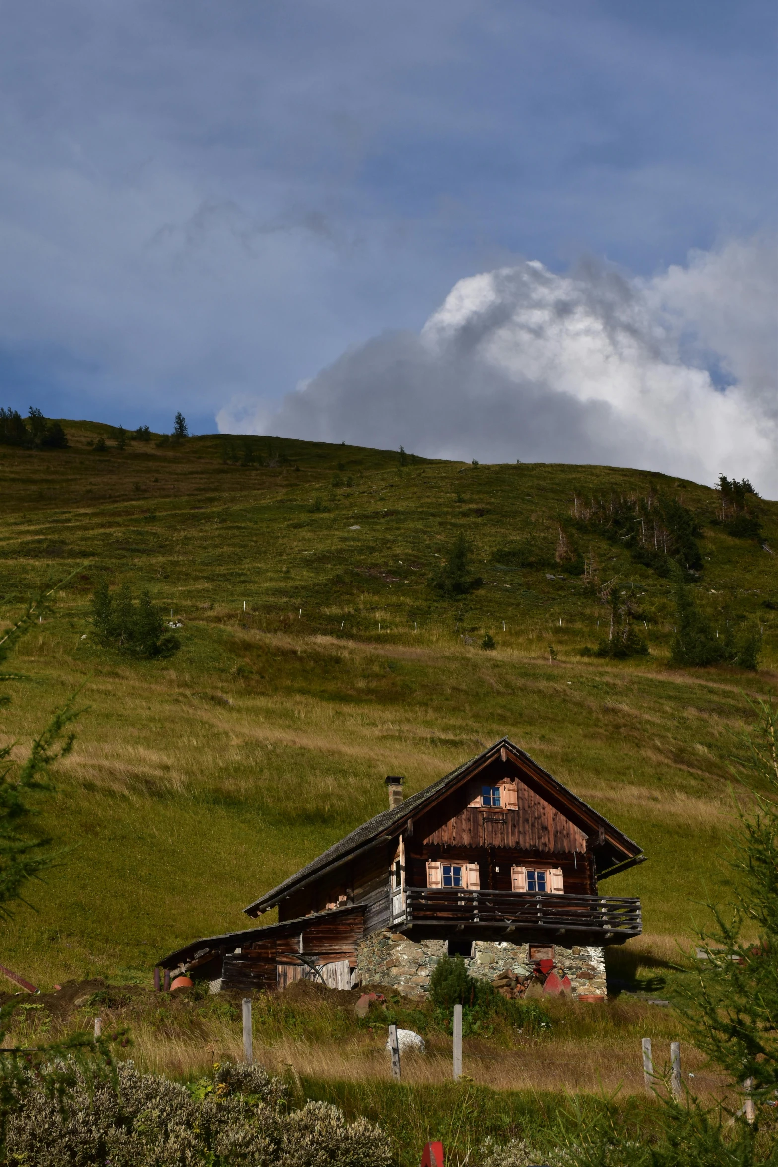 the view of a very nice old building in a field