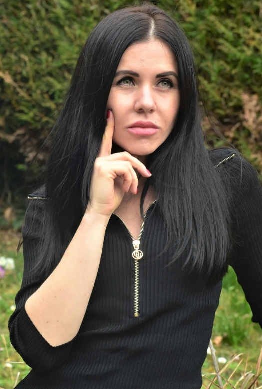 a woman poses for a po outside in a park