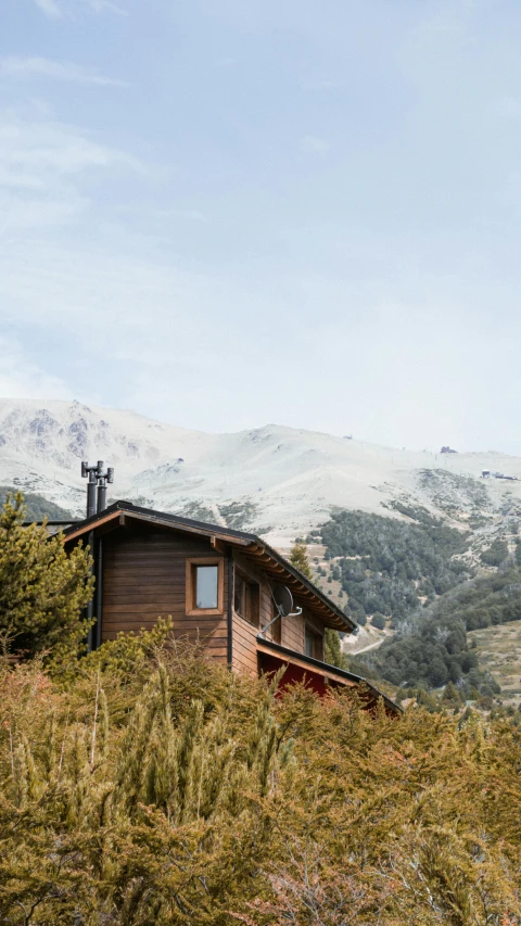 a building sits on top of the mountain