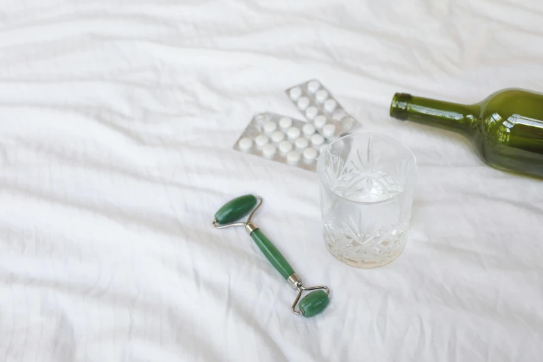 there are pills, and bottles on a bed