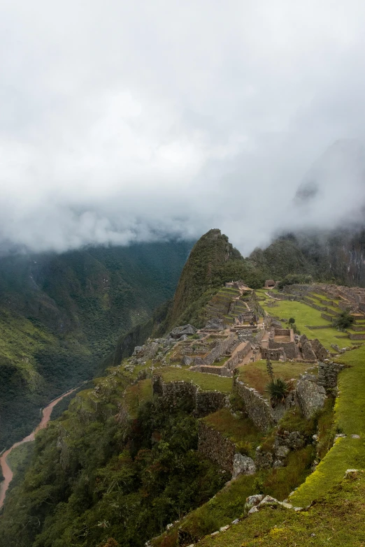 a very scenic mountain side with a small village in the center