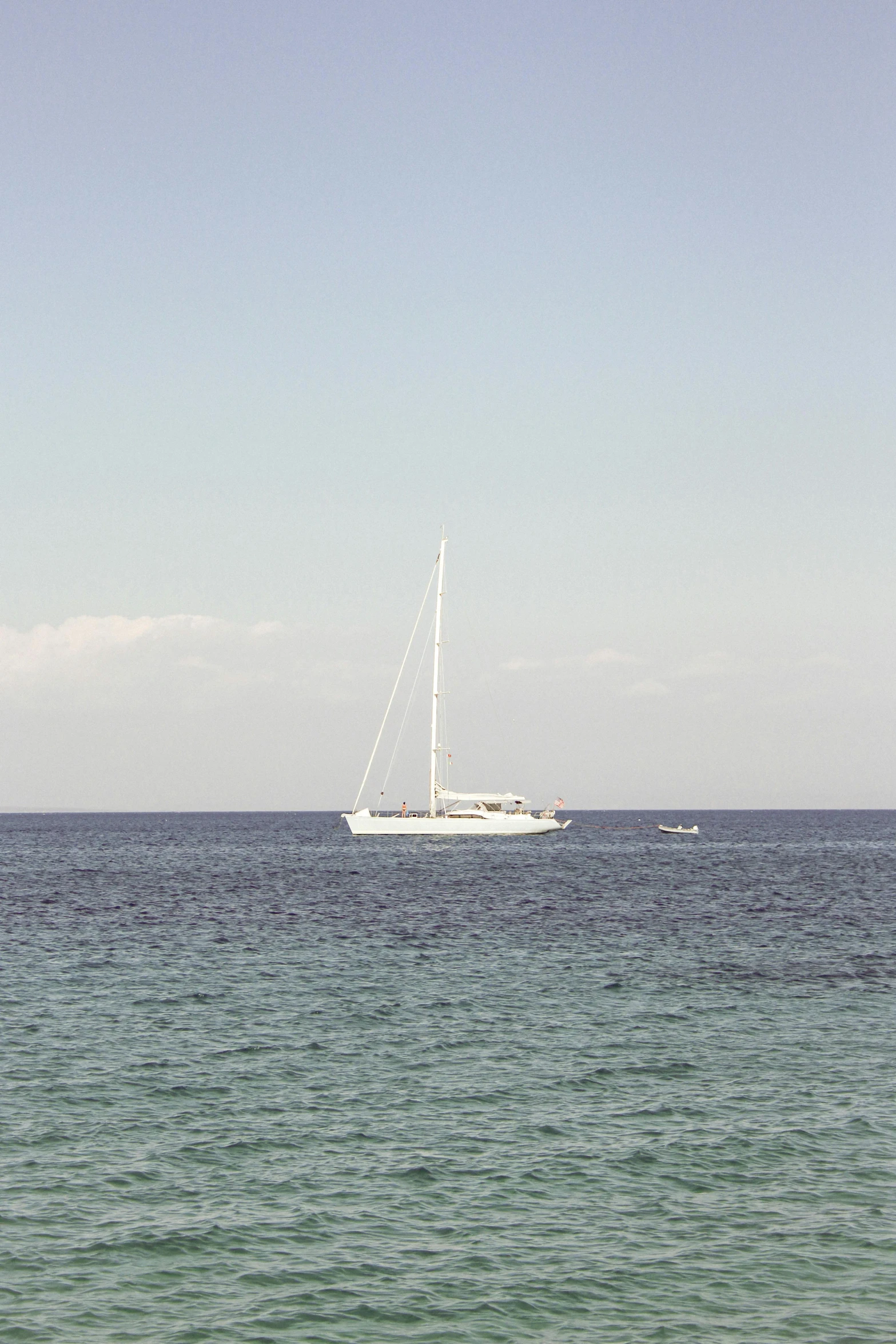 a lone boat in the middle of the water