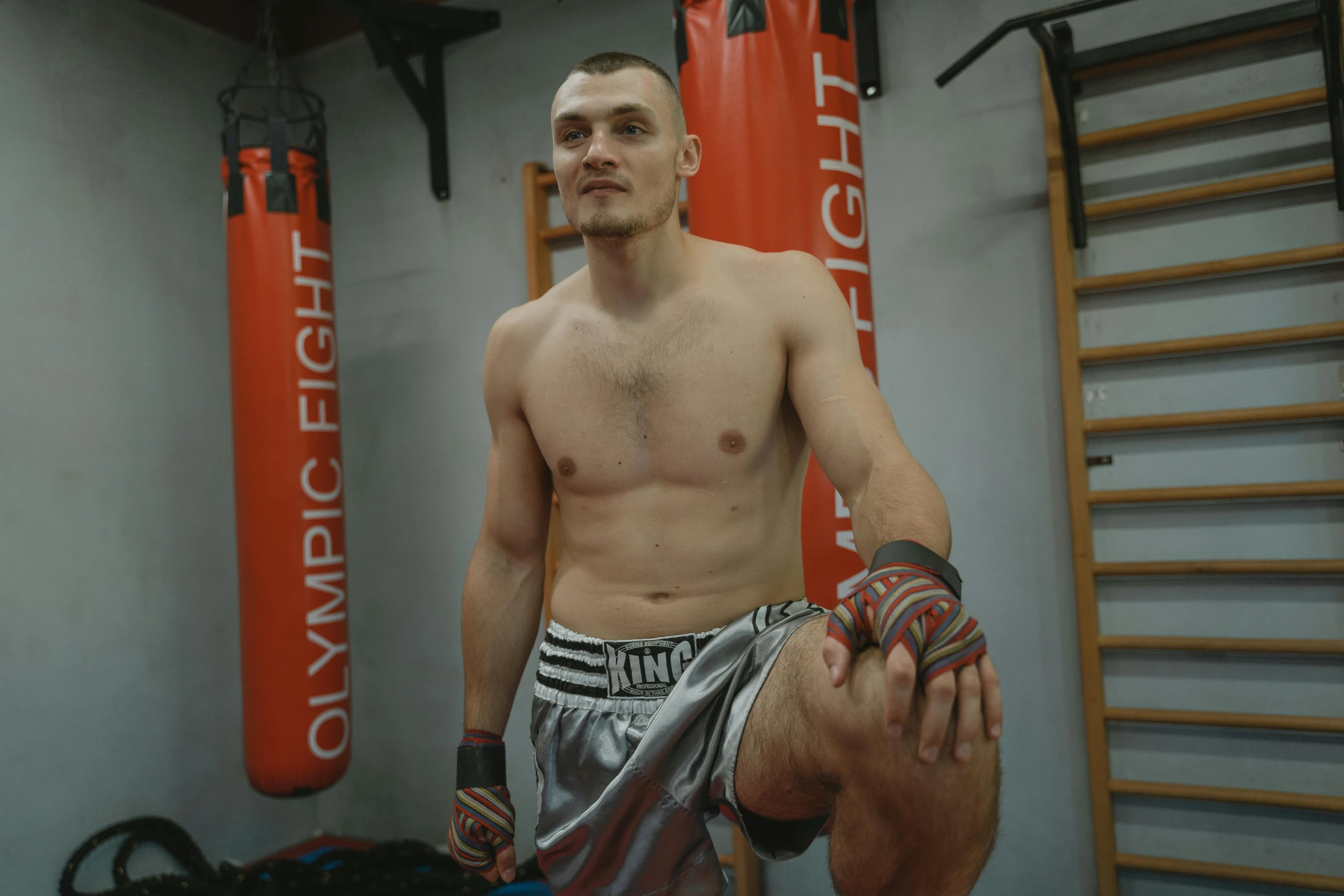 an image of a shirtless guy preparing to do boxing