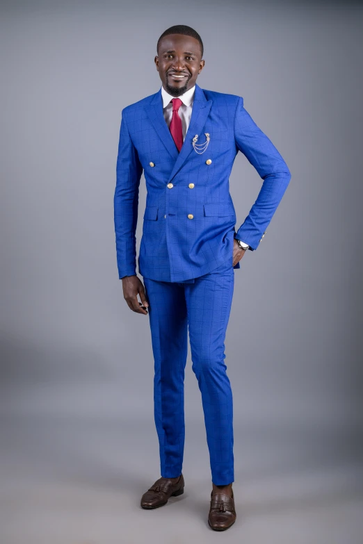 a man in a blue suit is posing for a po