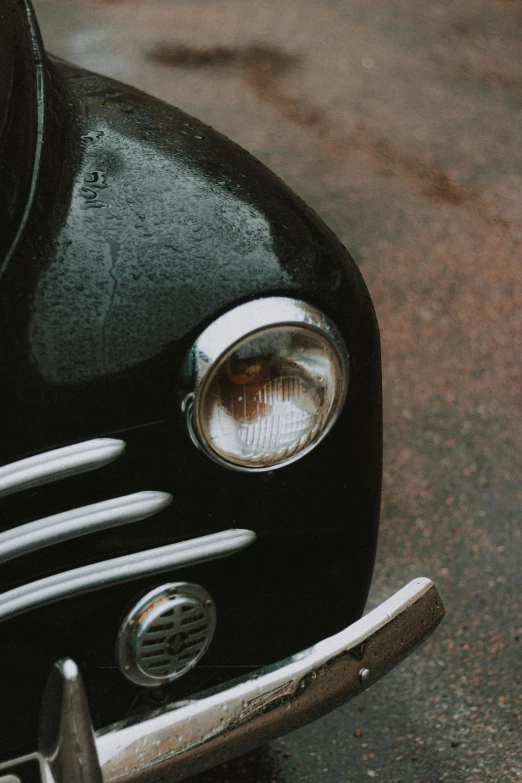 the front part of an old black car