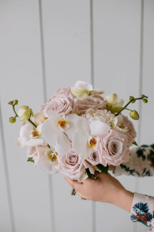 this bride has a hand bouquet of flowers for her wedding