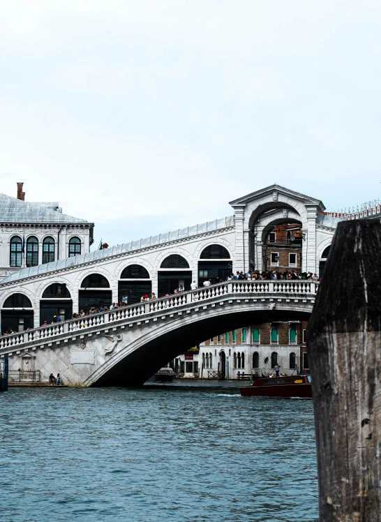 a bridge and some buildings over a body of water