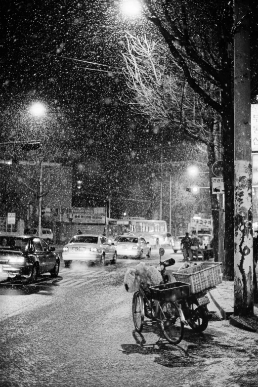 black and white pograph of a city street at night