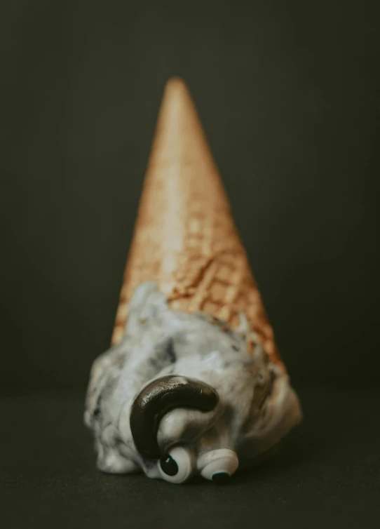 a sculpture of a head in the shape of an ice cream cone