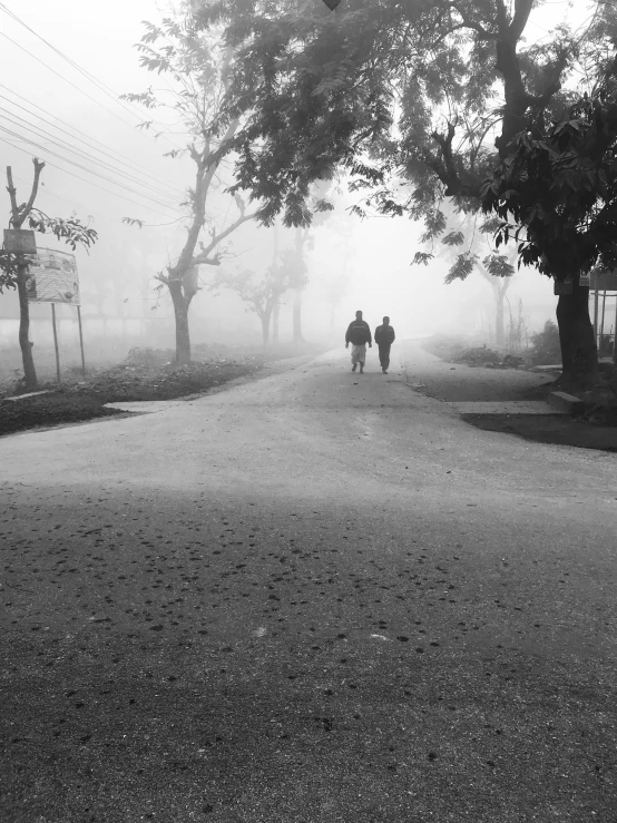 a group of people are walking down the street