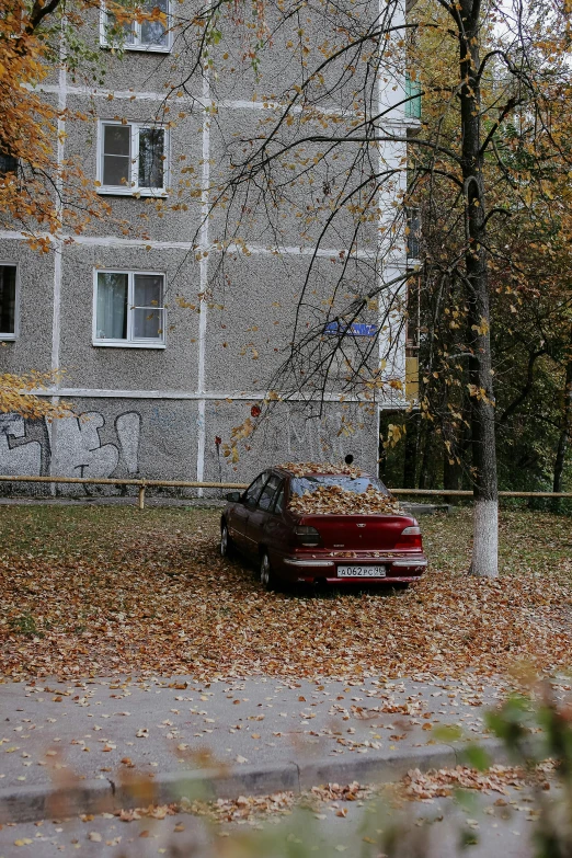 the car is on the road behind the fence