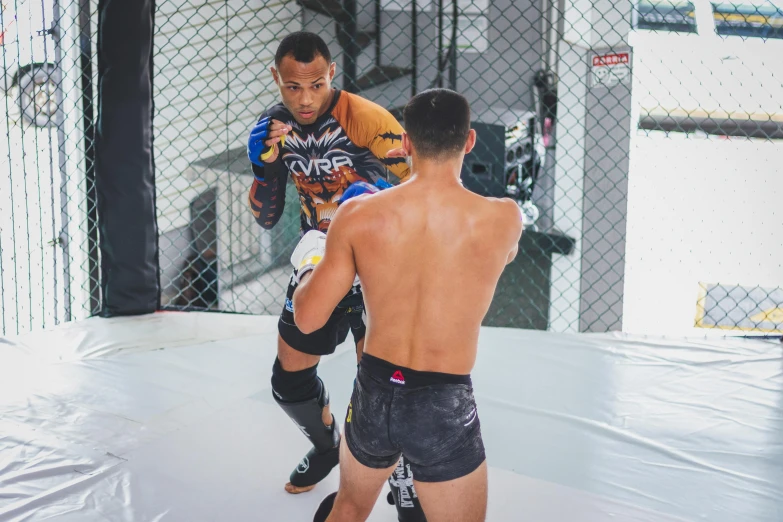 a man standing on a wrestling pad