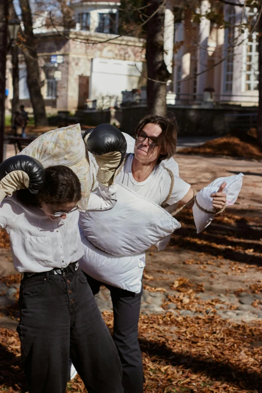 the woman has a pillow in her hands