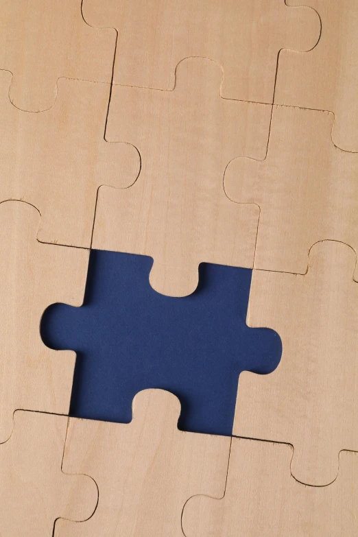 the missing piece of a puzzle is seen on a table