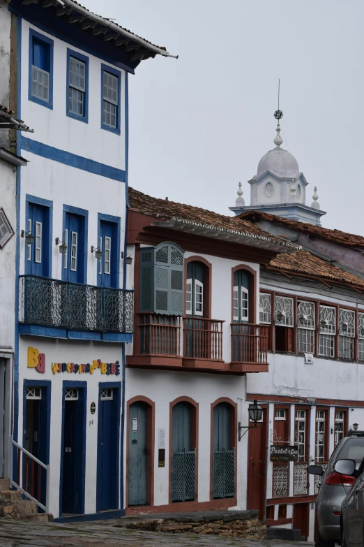 several houses with blue, white and red walls