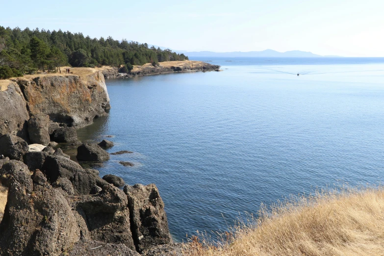 an empty body of water sits on the edge of some cliffs