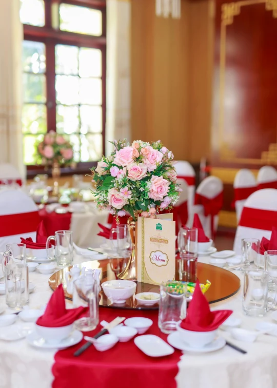 an empty dining room with red and white decorations