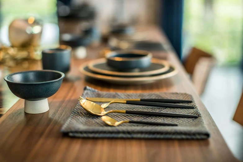 a close up of a table with place settings