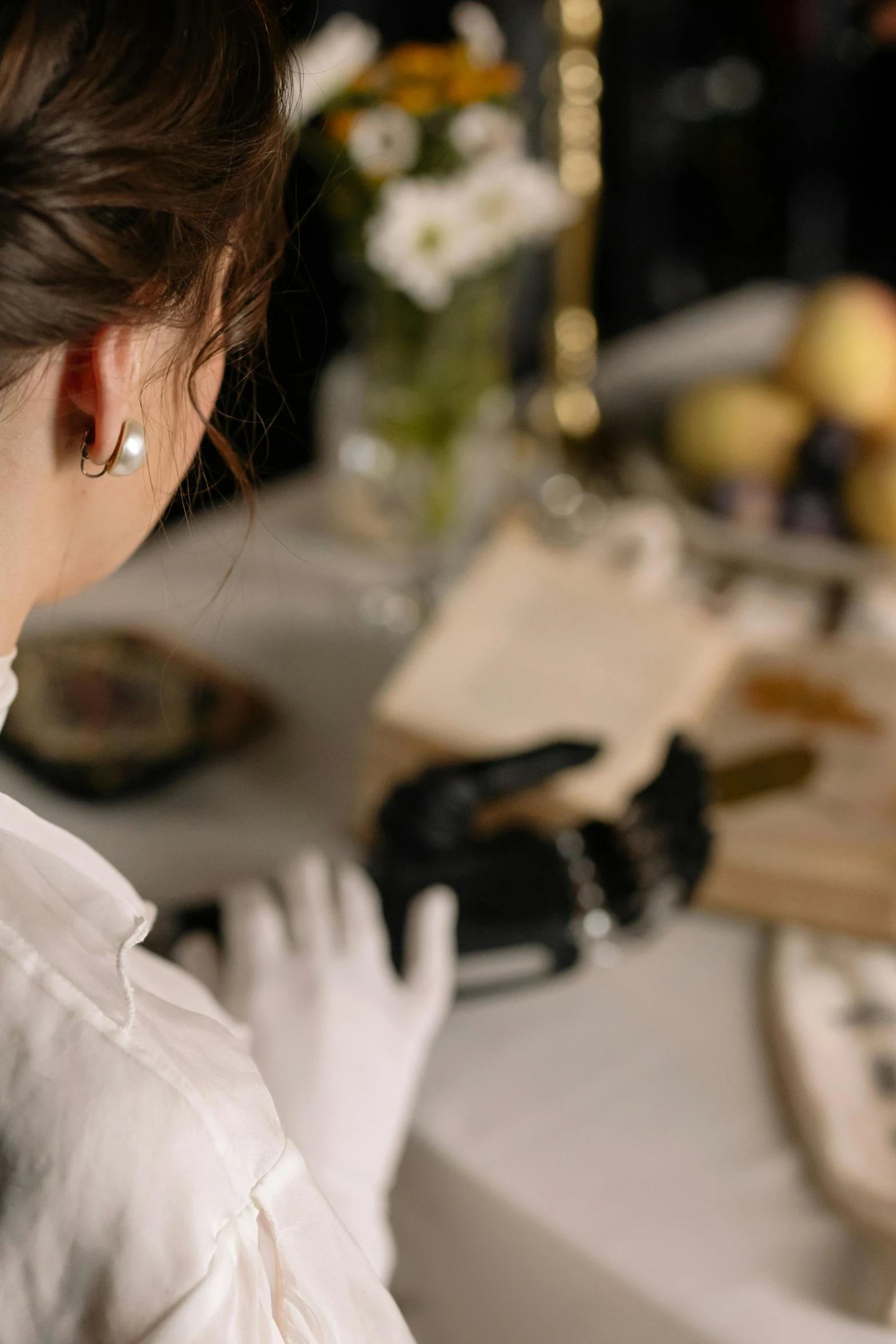 a woman that is wearing some kind of ear rings