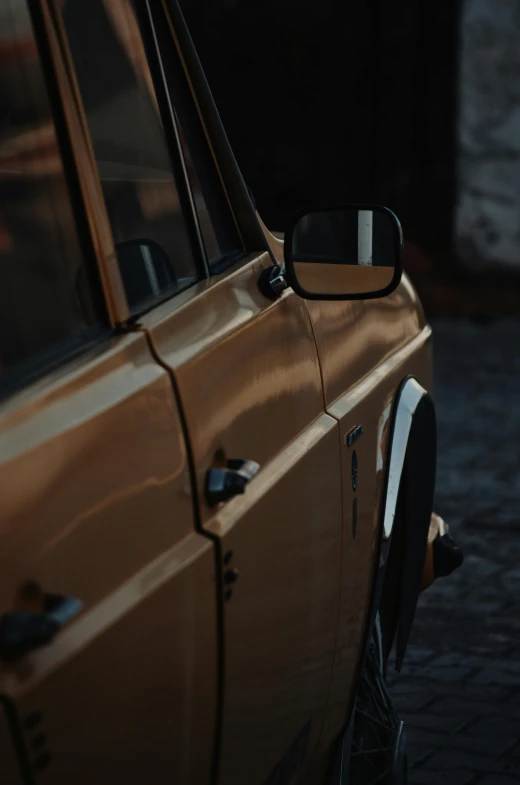 a car's side view mirror on the side of a car