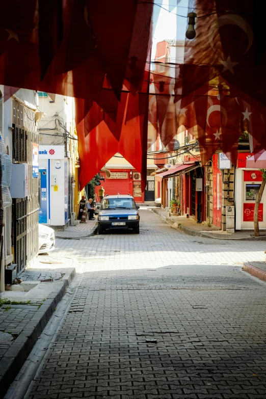 car parked on brick street in urban area