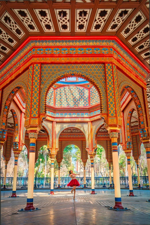 a colorful structure that has pillars and an archway between it