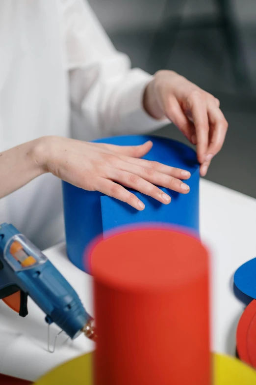 a woman's hands are sitting on a table