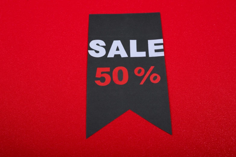 a sale sign with the letters sale 50 % on it