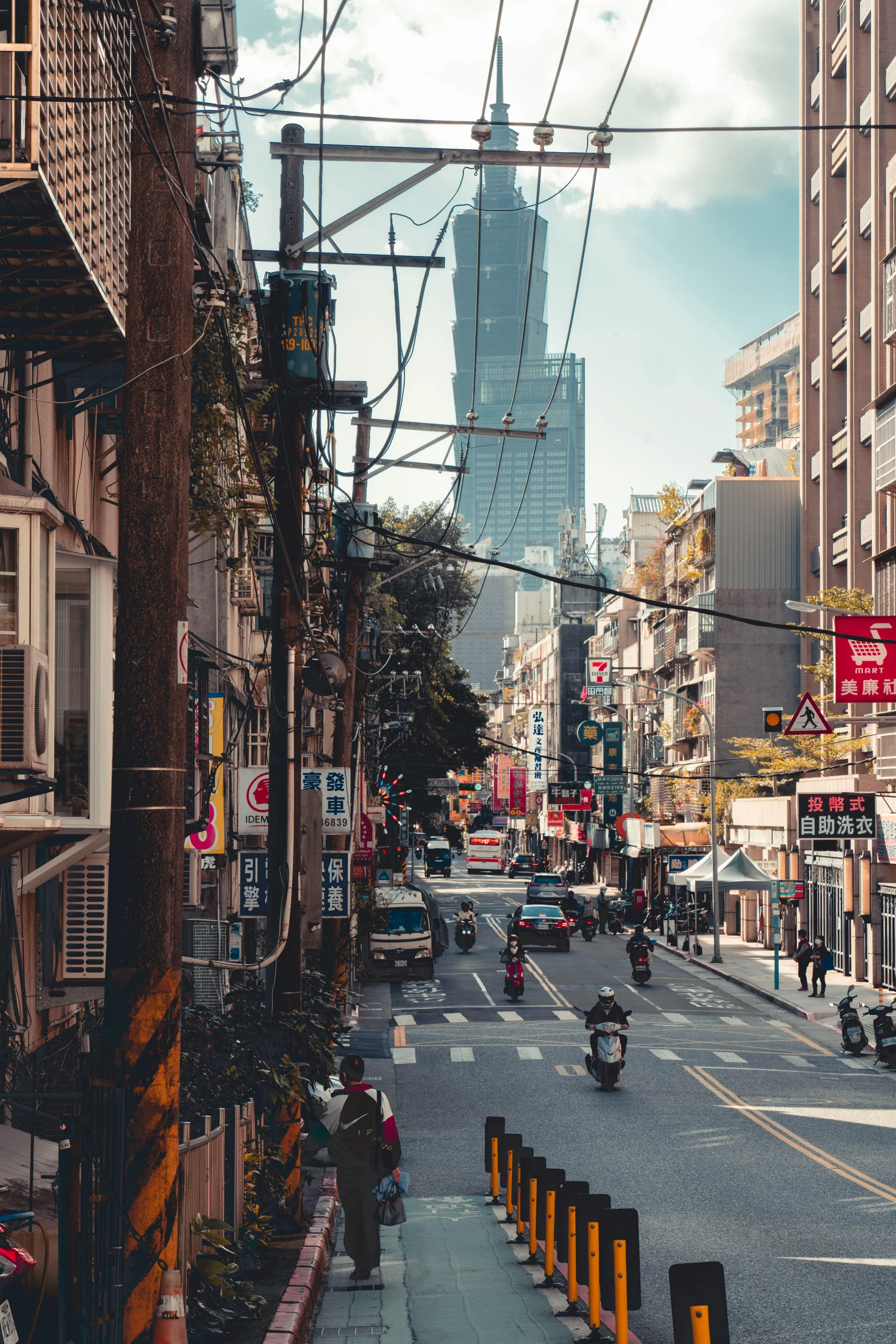 a city street scene with a lot of traffic and buildings