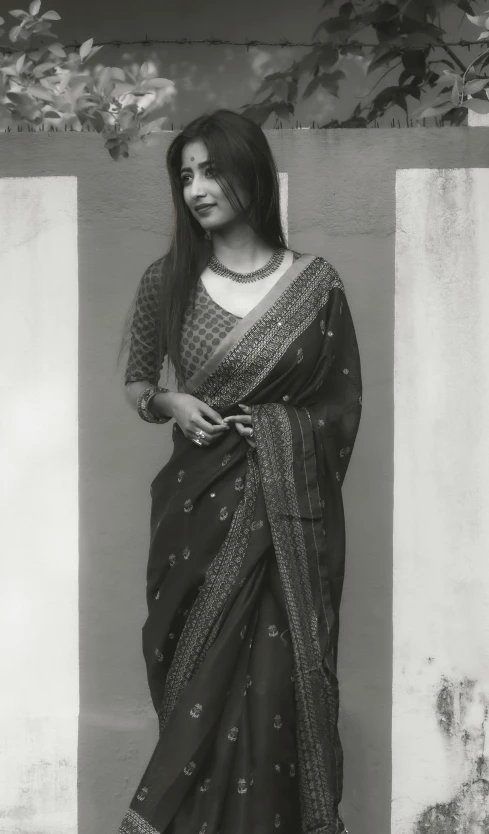 a young indian woman in a black and white po