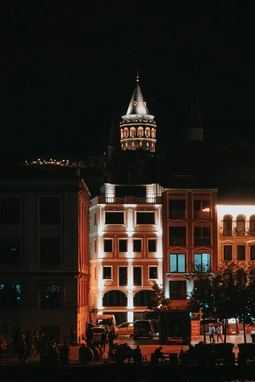 there is a large building at night in the distance