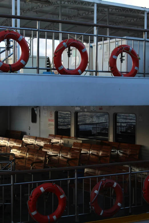 view of the outside of a passenger ship with life preservers in front