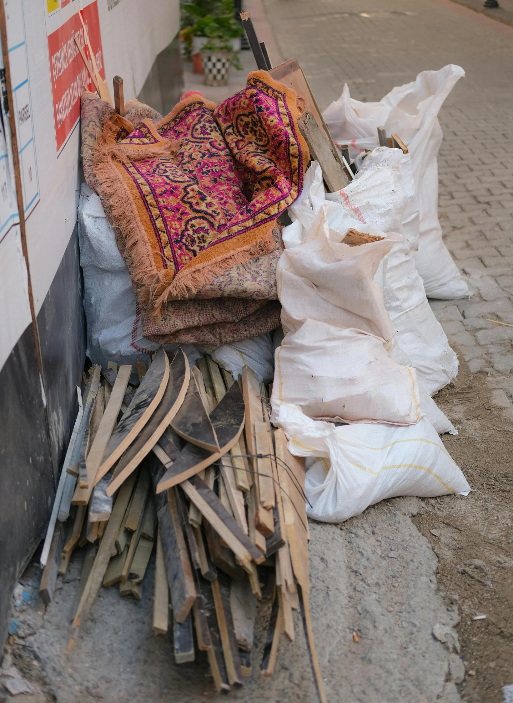 bags and clothing on a street corner