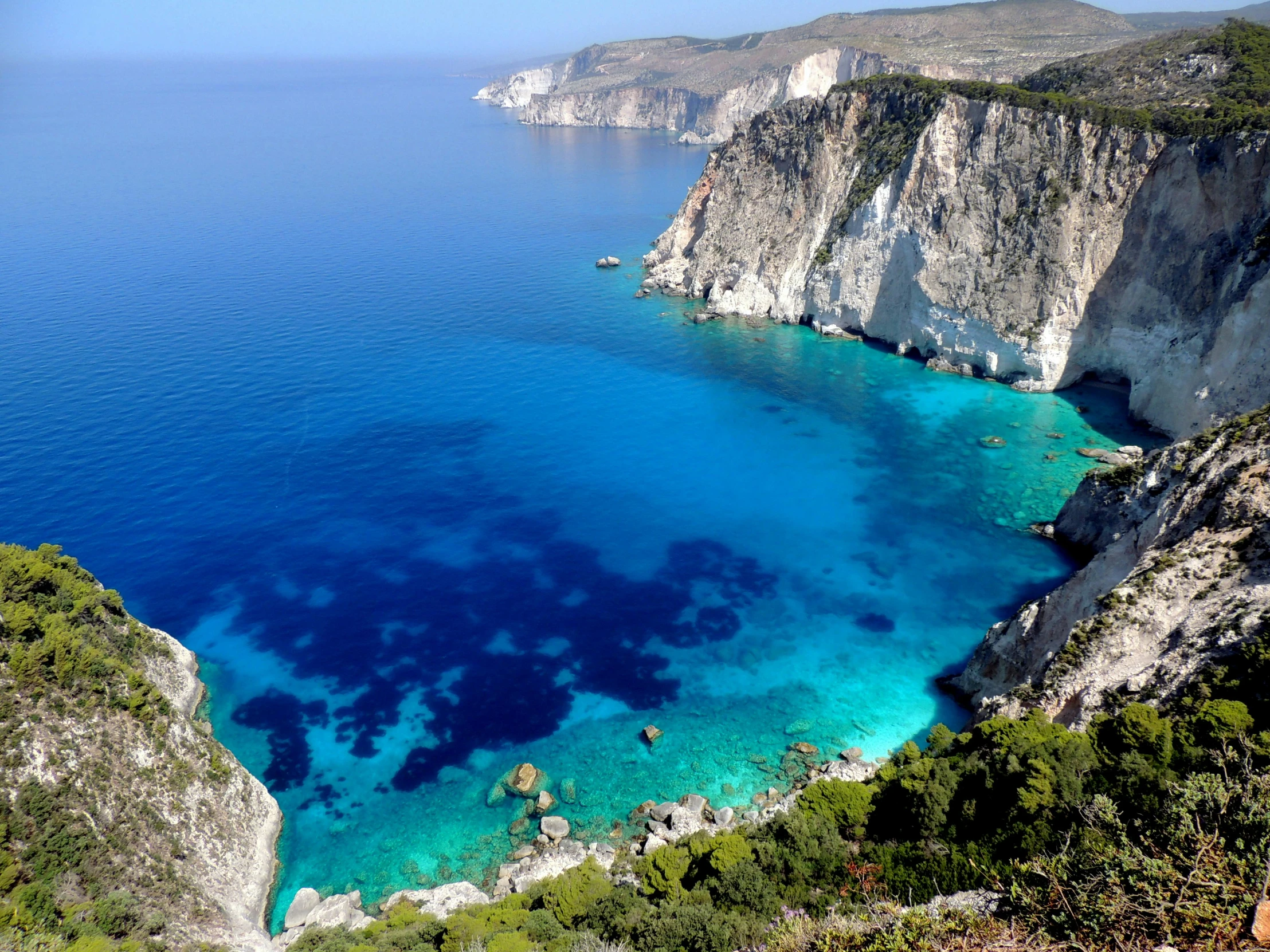 blue water and cliffs on a rocky mountain top