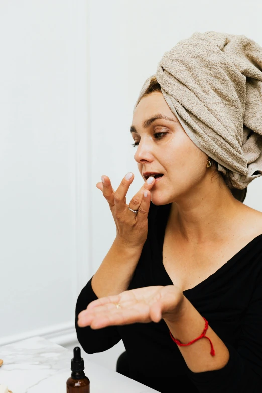 a woman is making a funny face with her finger