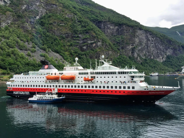 a cruise ship is docked in the water at the dock